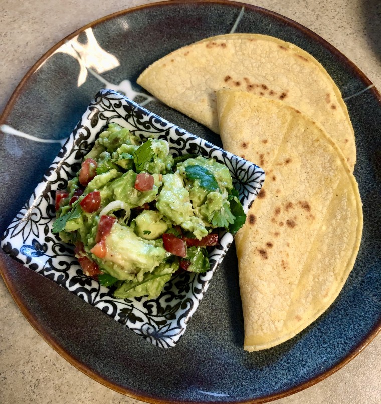 Chunky guacamole is absolute heaven on a salad, with quesadillas, or with hearty corn chips. Cilantro optional.