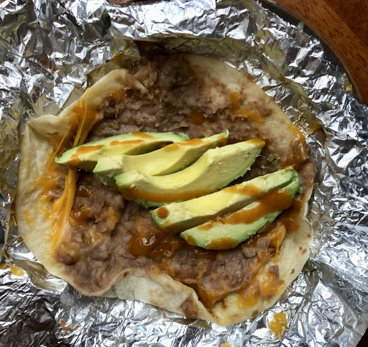 Don’t hate me 'cause I’m beautiful: a sliced, dry-refrigerated avocado reaches its highest purpose in a Tex-Mex breakfast taco with a little hot sauce.