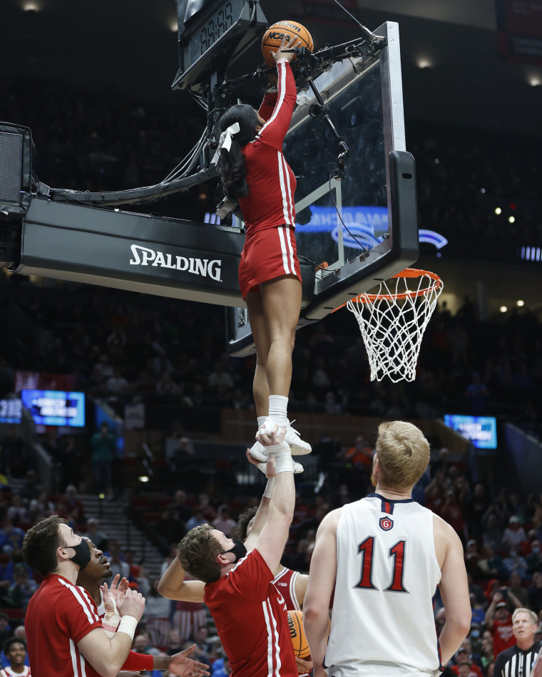 Nathan Paris lifts Cassidy Cerny to grab the basketball off the backboard during the second half of Indiana's first-round NCAA Tournament game against Saint Mary's in Portland, Ore.