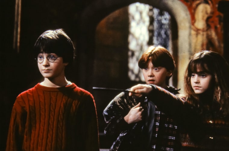 Daniel Radcliffe as Harry Potter, far left, starred in the "Harry Potter" film franchise from 2001 until 2011 alongside co-stars Rupert Grint, as Ron Weasley, and Emma Watson, as Hermione Granger.