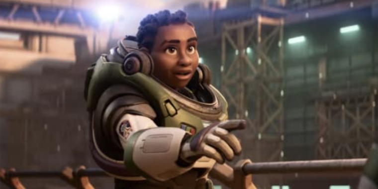 a young black person in a lightyear suit points at an unseen object