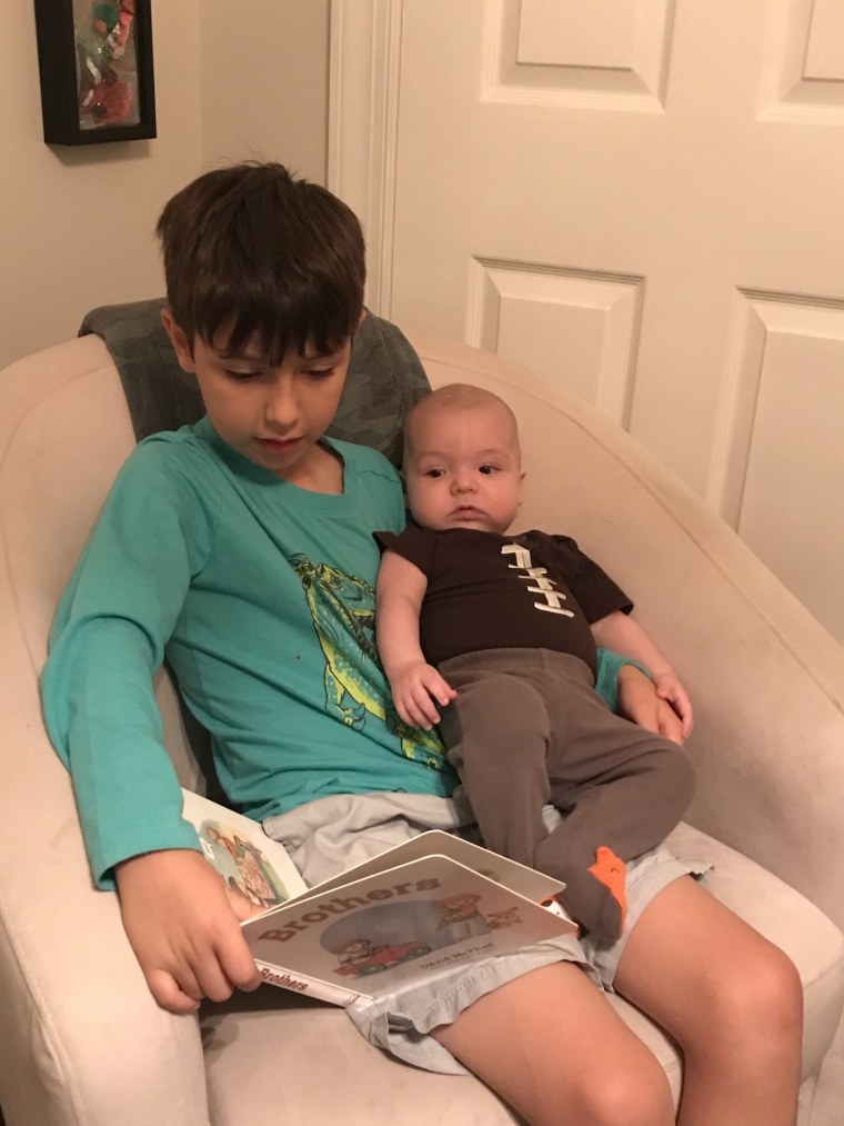 Hudson reads to his little brother, Monty.