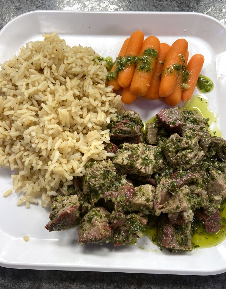 One of Veldeer's menu items: flank steak with chimichurri, baby carrots and rice.