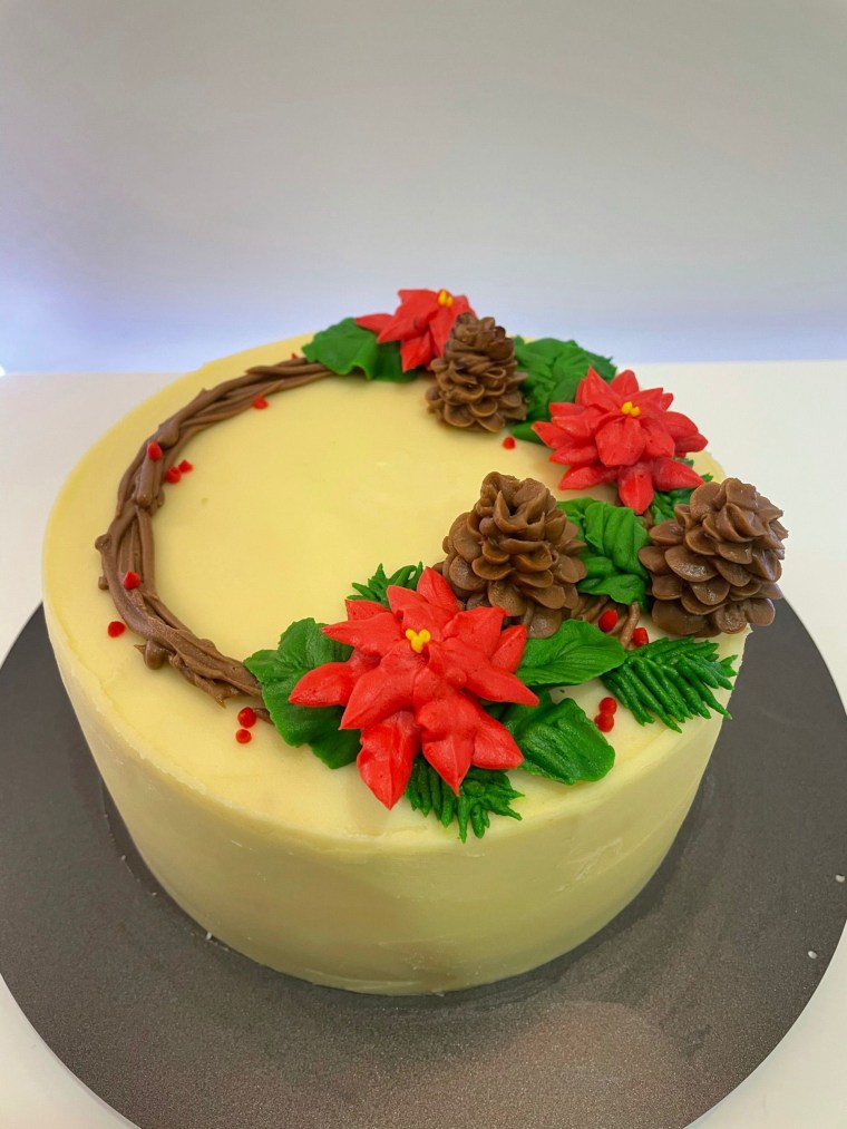 One of the things I fell in love with in cake decorating was piping — specifically flowers and leaves. I remember getting so carried away with this design and was Googling away to look at ways to pipe different leaves, pine cones and flowers. I was very proud of this one! 
