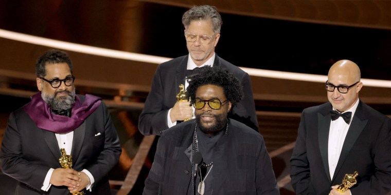 Joseph Patel, Robert Fyvolent, Questlove and David Dinerstein accept the documentary award for "Summer of Soul" at the 2022 Oscars.