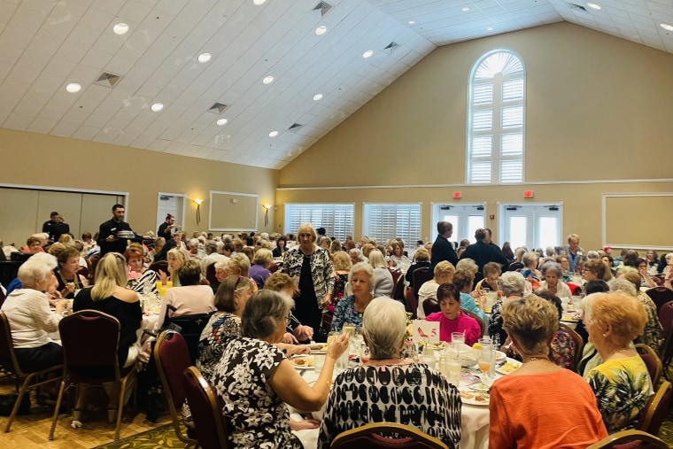 Manna rarely has to leave the retirement community. Her days are now broken up by social events like this women's luncheon, which followed a fashion show.