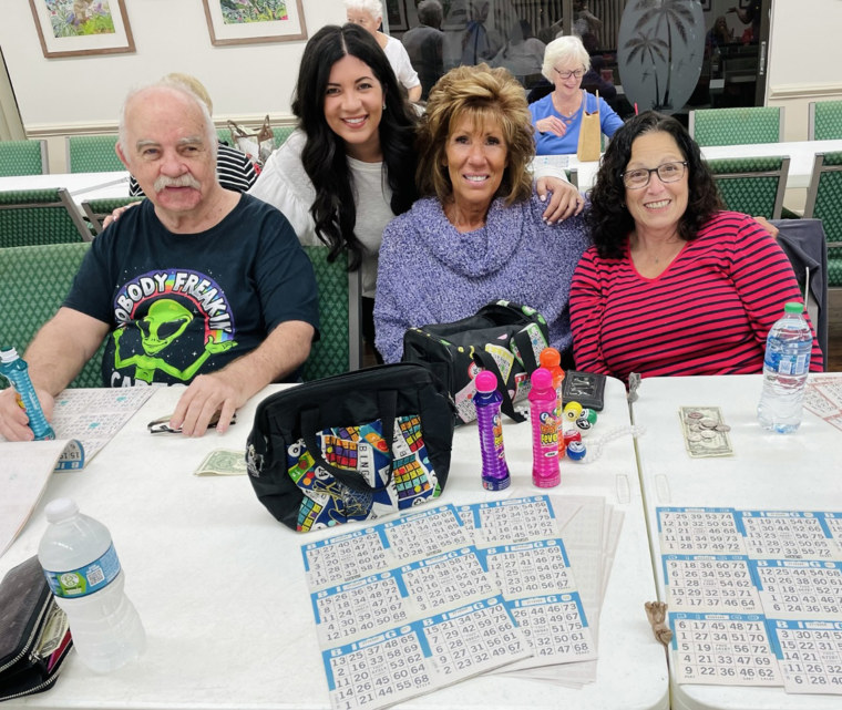 Christina Manna poses with her mother and friends during a game of bingo.
