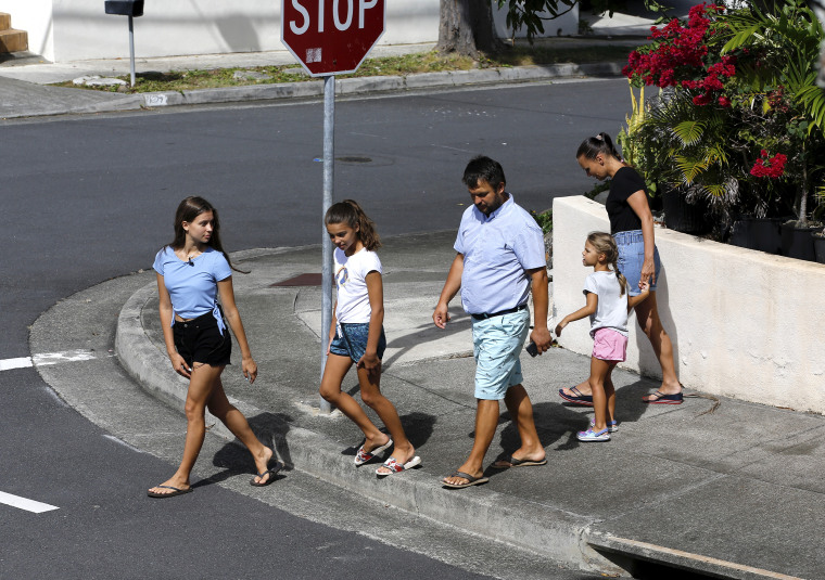 Vasyl Prishchak, center, of Kyiv, Ukraine, walks with his wife, Marina, right, and daughters, Ksenia, 5, second from right, Sofiia, 10, second from left, and Mariia, 16, left, in Kailua, Hawaii, Wednesday, March 23, 2022. The Prishchak family travelled to Hawaii for a long-awaited vacation on Feb. 16 and planned to return to Ukraine on March 7. But a week into their vacation, Russia invaded their country, leaving the family in shocked disbelief with no access to family, friends, money or their home.