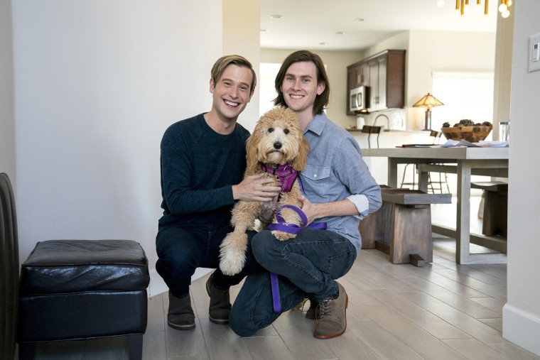 Henry with his partner, Clint Godwin, and their dog, Nanci.
