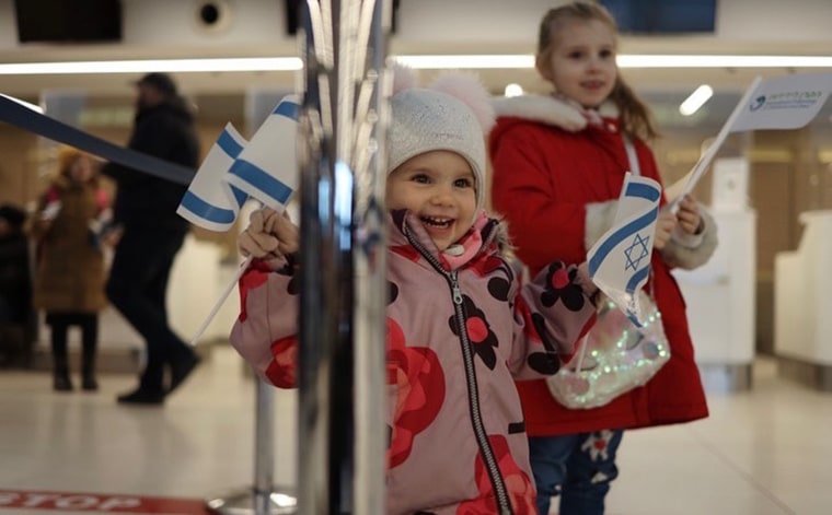 A smiling toddler, finally safe from war-torn Ukraine.