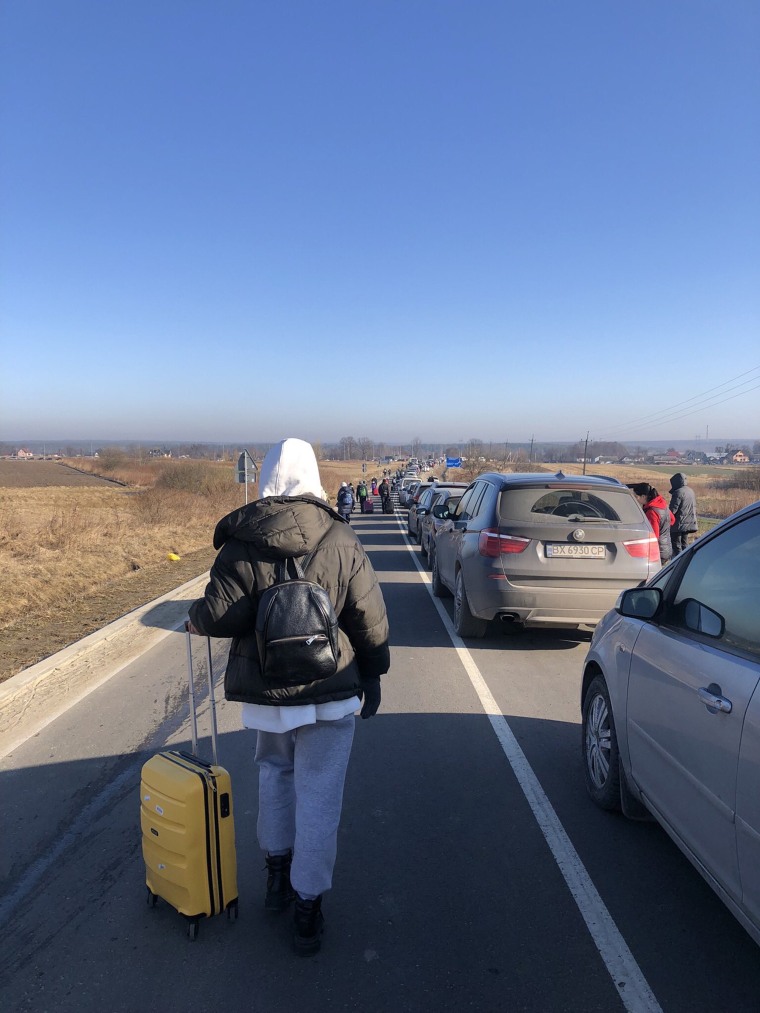 Over 3.5 million Ukrainians have fled the country as the result of Russia's war on Ukraine. Pictured, the line of refugees walking on foot towards the Poland-Ukraine border.