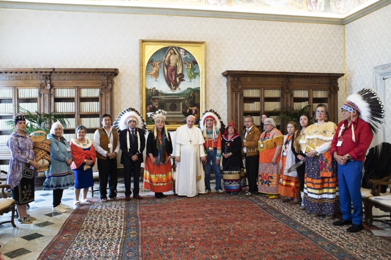 Indigenous delegates from Canada's First Nations pose for a photo with Pope Francis