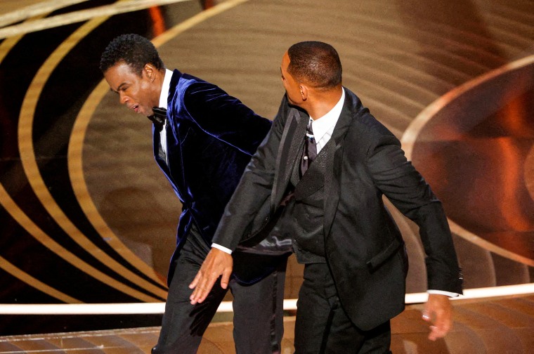 Will Smith hits Chris Rock during the 94th Academy Awards in Hollywood, Calif., on March 27, 2022.