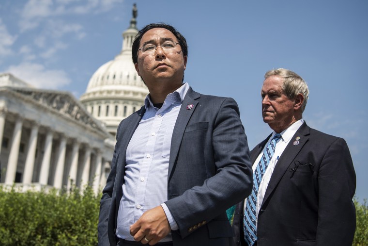 Reps. Andy Kim, D-N.J., center, and Joe Wilson, R-S.C., right, attend a news conference outside the U.S. Capitol on Aug. 25, 2021.
