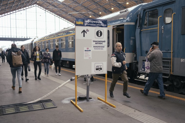 A sign displays information for Ukrainians along the platform at Nyugati train station in Budapest. 