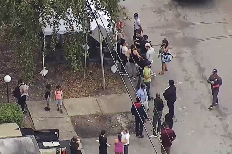 A condominium building in North Miami Beach, Fla., that was deemed structurally unsafe is evacuated Monday. 