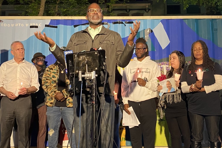 Bishop Parnell M. Lovelace, Jr. of Center of Praise Ministries, leads city leaders and community members in prayer.