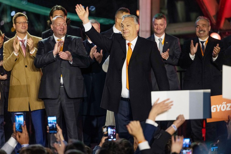 Image: Hungarian Prime Minister Viktor Orbán greets supporters after announcing partial results of the general election in Budapest on April 3, 2022.