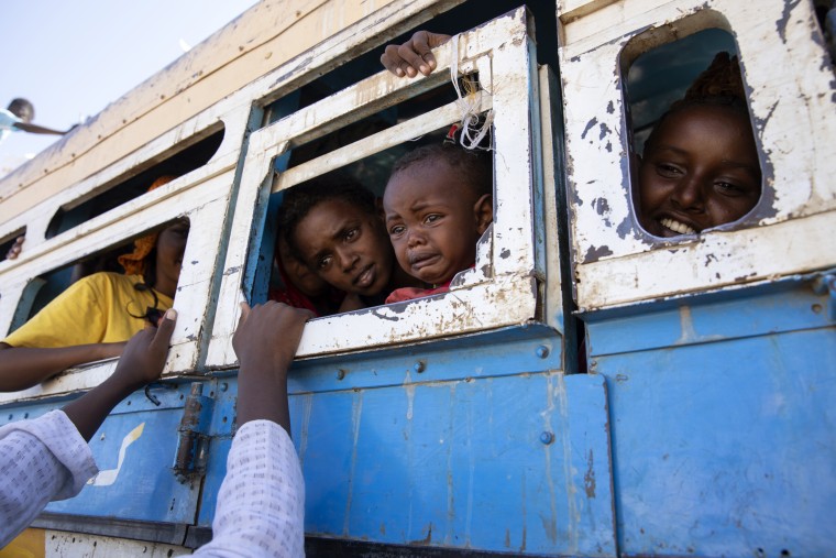 Refugees from Ethiopia's Tigray region ride a bus