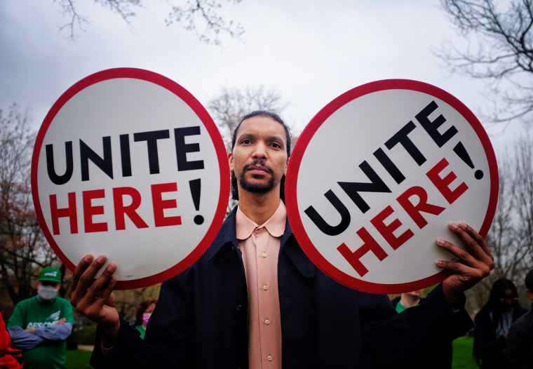 A Senate cafeteria worker protests near the U.S. Capitol earlier this week.