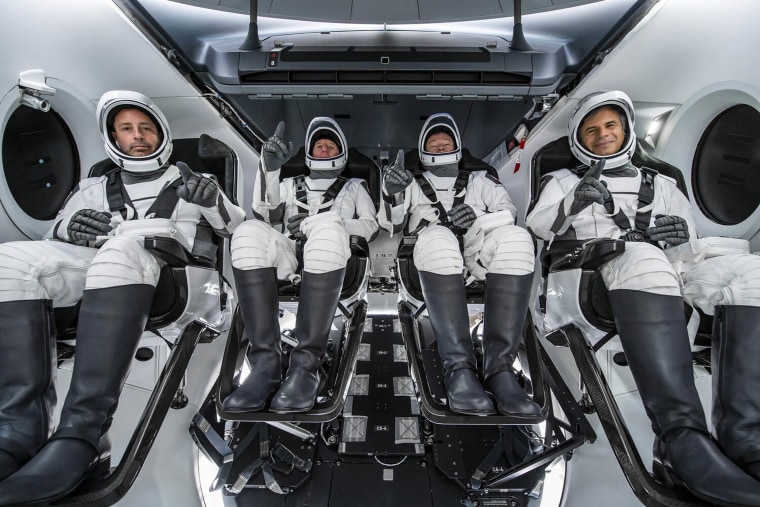 The Ax-1 crew inside SpaceX's Dragon capsule