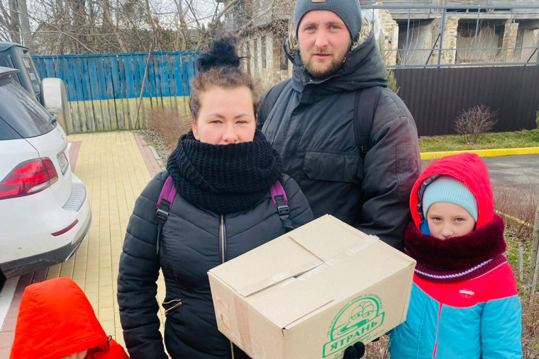 The Lupanov family, Victor, Anastasiia, Eva, 8, and Ivan, 5, picking up food from World Central Kitchen workers in the formerly Russian occupied village of Lubyanka, near Kyiv, on Wednesday.