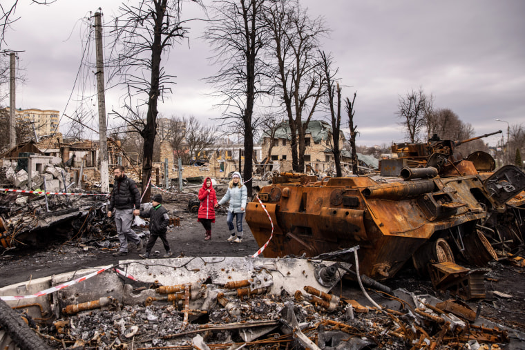 Residents walk in Bucha, Ukraine