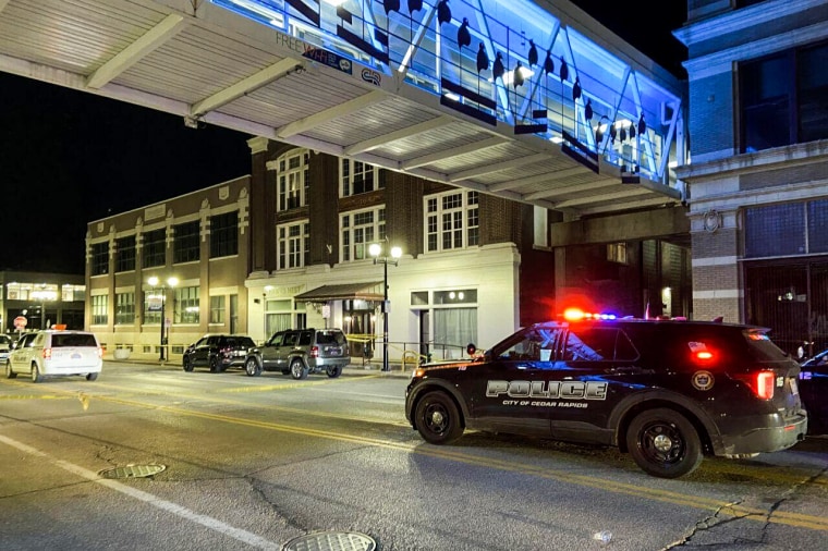 Police respond at the scene of a shooting in Cedar Rapids, Iowa, April 10, 2022.