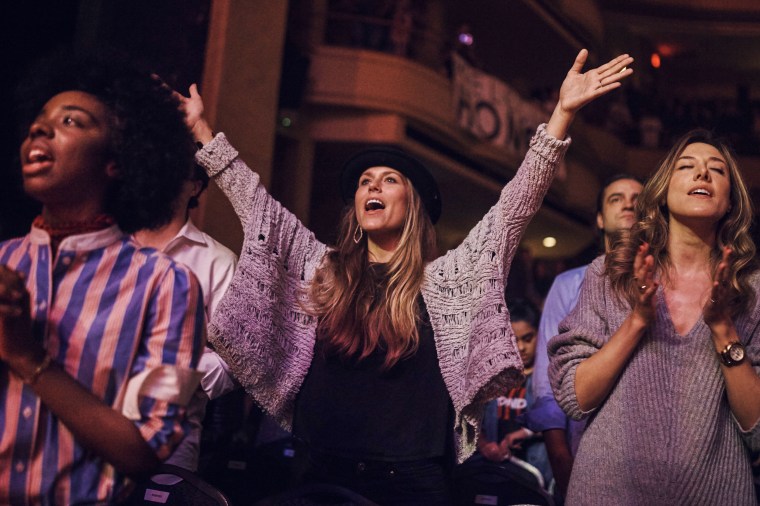 People pray during a service at Hillsong Church on Oct. 22, 2017, in New York.