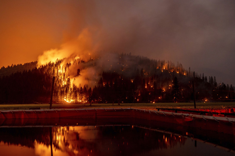 Flames from the Dixie Fire spread in Genesee, Calif., on Aug. 21, 2021.