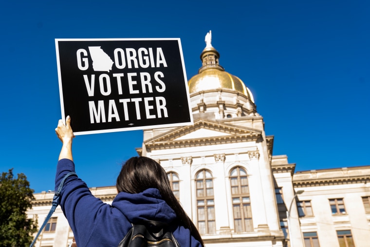 Demonstrators stand outside of the Georgia Capitol building, to oppose the HB 531 bill on March 3, 2021, in Atlanta, Georgia.
