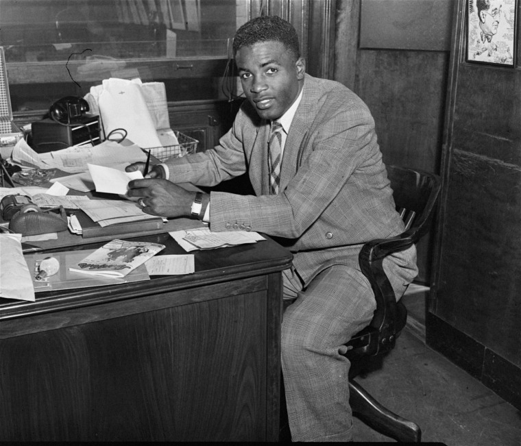 Jackie Robinson, who broke baseball's color barrier, alongside his Brooklyn  Dodgers teammates in 1947. (Robinson pictured with John Jorgensen, Pee Wee  Reese and…