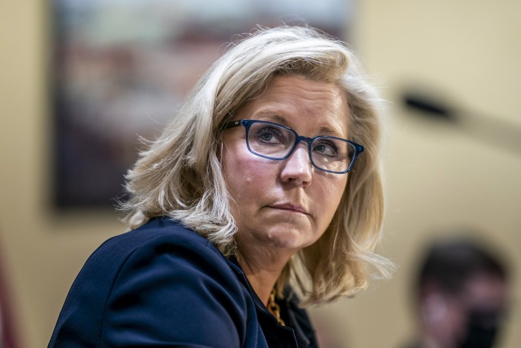 Vice Chair Liz Cheney, R-Wyo., of the House panel investigating the Jan. 6 U.S. Capitol insurrection, listens as Chairman Bennie Thompson, D-Miss., speaks on Dec. 14, 2021.