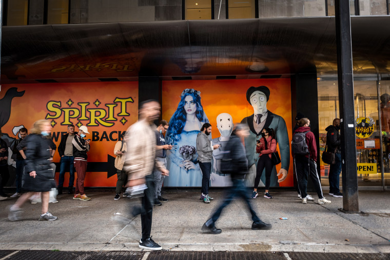 People wait in line outside a Spirit Halloween store in Chelsea on Oct. 26, 2021 in New York.