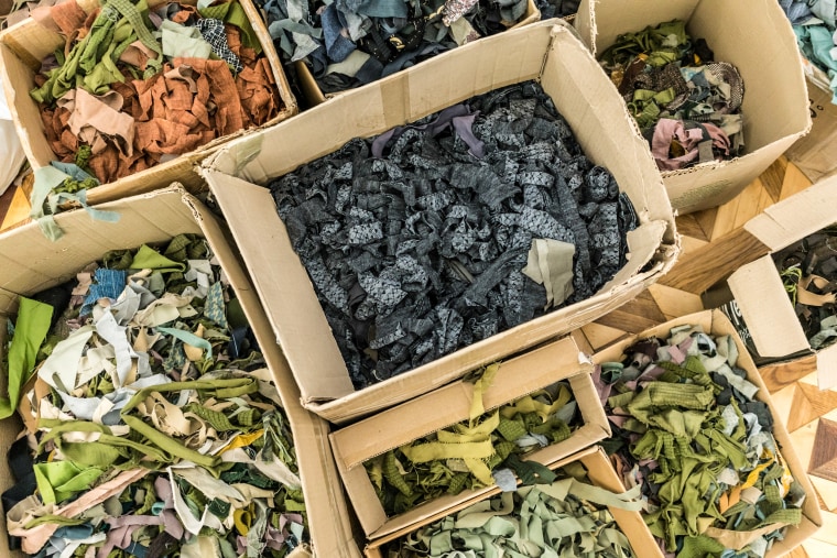 Strips of cloth used by volunteers to make camouflage nets for the Ukrainian military sit in boxes at the Roman Ivanychuk Regional Youth Library on April 12, 2022, in Lviv, Ukraine.