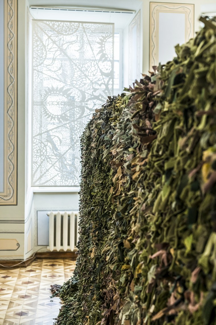 A camouflage net made by volunteers for the Ukrainian military hangs on a rack at the Roman Ivanychuk Regional Youth Library on April 12, 2022, in Lviv, Ukraine.