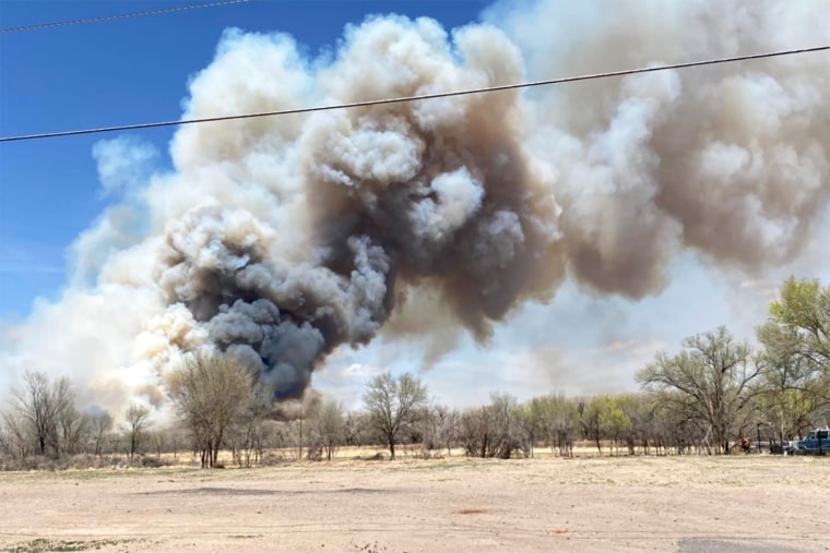 Smoke billows from a fire near the Bosque north of Rio Communities, in New Mexico, on April 11, 2022.