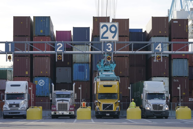 Trucks line up to have containers loaded at the Norfolk International Terminal in Norfolk, Va., on Dec 1. Walmart workers who once unloaded trucks now have a chance to drive them. The country’s largest retailer has launched a training program for employees who work in its distribution or fulfillment centers. 