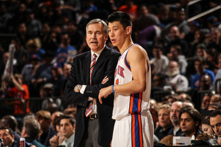 Mike D'Antoni head coach of the New York Knicks speaks with Jeremy Lin #17 during the game against the Philadelphia 76ers on March 11, 2012 at Madison Square Garden in New York.