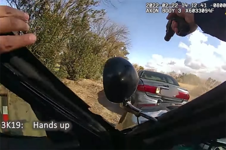 A Stockton police officer shouts, "hands up" as the car driven by Tracy Gaeta backs up into his car.