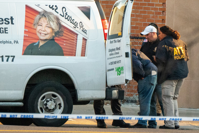 Image: Members of the NYPD bomb squad inspect a U-Haul van believed to be associated with the suspect of the April 12, 2022 shooting in New York City.