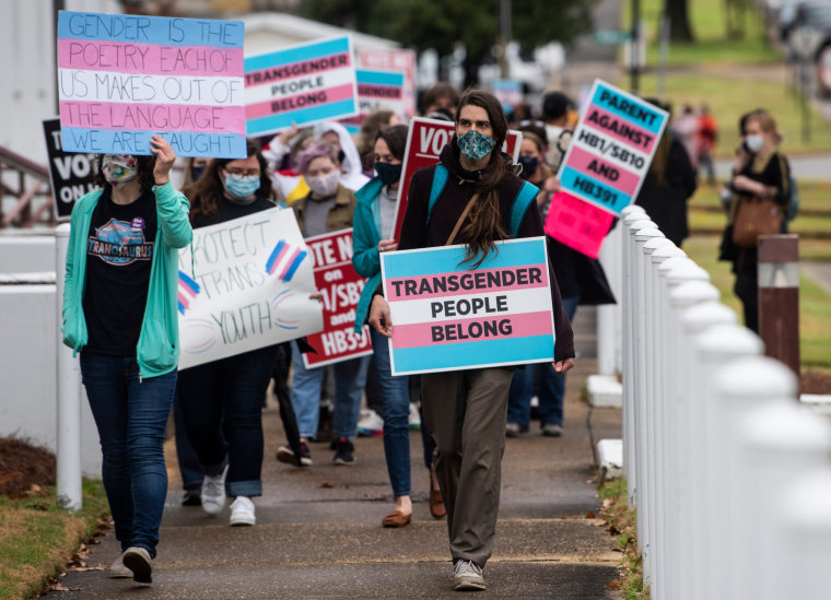 Image: Protestors in support of transgender rights march around the Alabama State House in Montgomery on March 2, 2021.