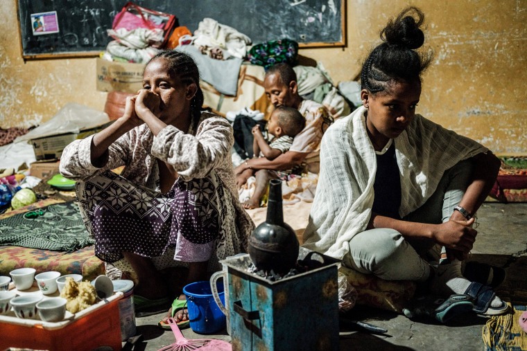 Women, who fled the violence in Ethiopia's Tigray region, prepare coffee in a classroom housing 25 mothers for more than seven months at an elementary school in Mekele, the capital of Tigray region, Ethiopia, on June 18, 2021.