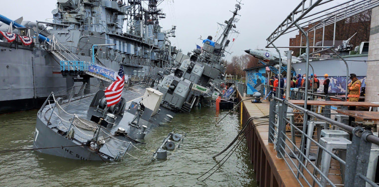 Image: The partially-sunk USS Sullivans  at the Military Park pier on the waterfront in Buffalo, N.Y.