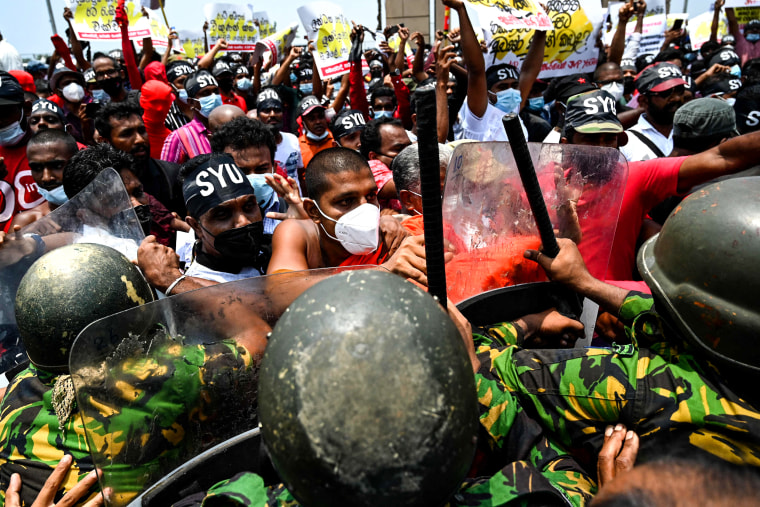 Police Special Task Force officers try to stop demonstrators during a protest against rising living costs, outside President Gotabaya Rajapaksa's seafront office in Colombo, Sri Lanka, on March 18, 2022.