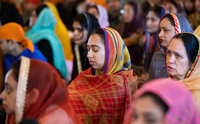 Image: A prayer service at the Sikh Satsang of Indianapolis on April 10, 2022 to remember the eight people killed at a FedEx facility on April 15, 2021.