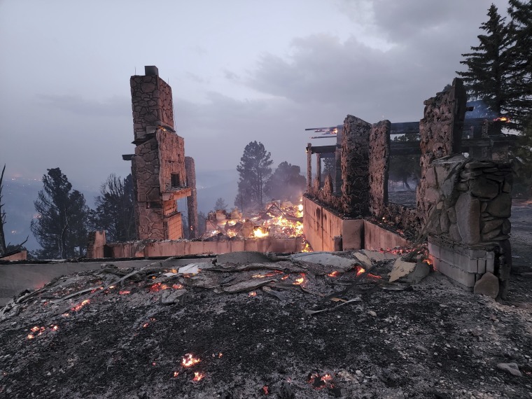 The remains of a home left after a wildfire spread through the Village of Ruidoso, New Mexico, on Wednesday, April 13, 2022.