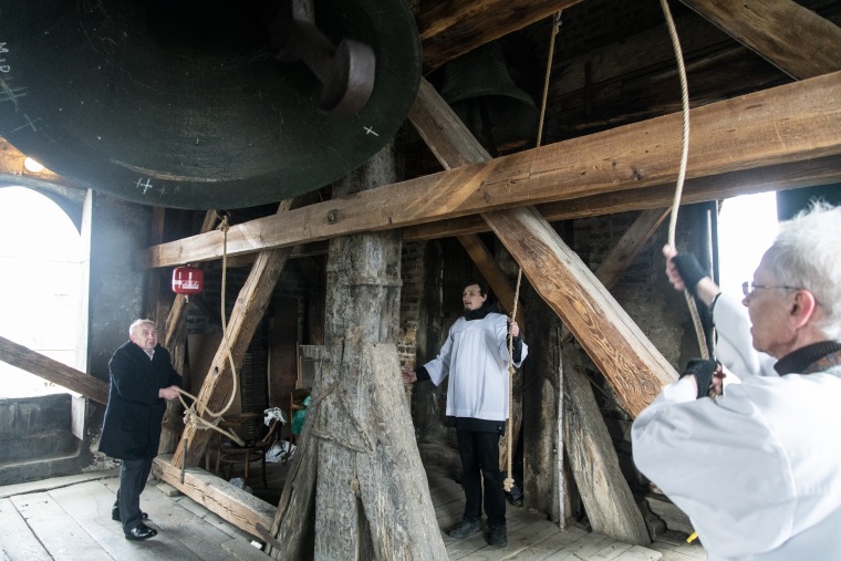 Church members ring the bell at the Cathedral Basilica of the Assumption in Lviv on Easter Sunday.