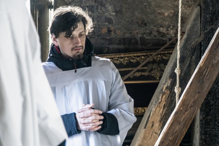 Sezhiy Bei prays in the bell tower atop the Cathedral Basilica of the Assumption in Lviv on Easter Sunday.