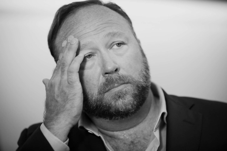 Alex Jones of InfoWars talks to reporters outside a Senate Intelligence Committee on Capitol Hill on Sept. 5, 2018